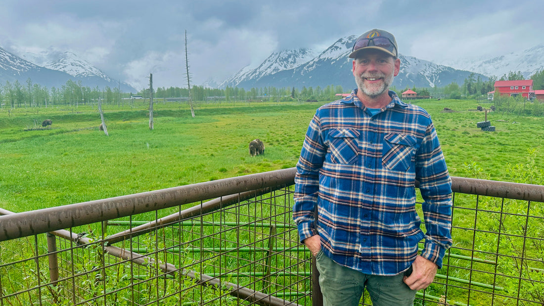 Photo of Matt Hertel In front of the Musk Ox Herd at AWCC