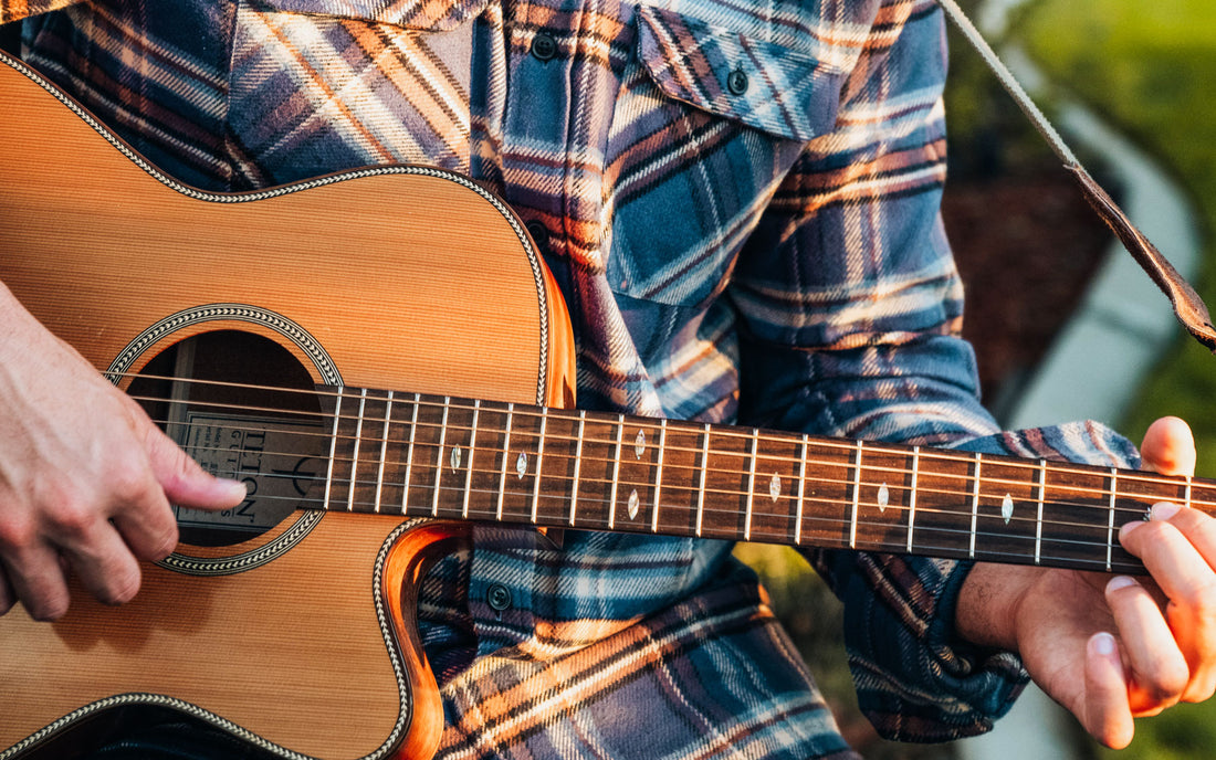 MuskOx Flannel, Man in Flannel playing a guitar