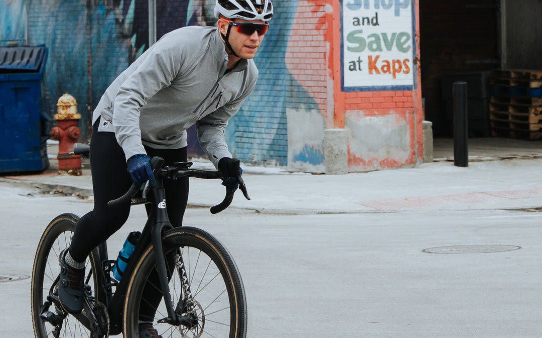MuskOx Outdoor Apparel, Image of Cyclist Wearing a Grey Quick Drying Quarter Zip