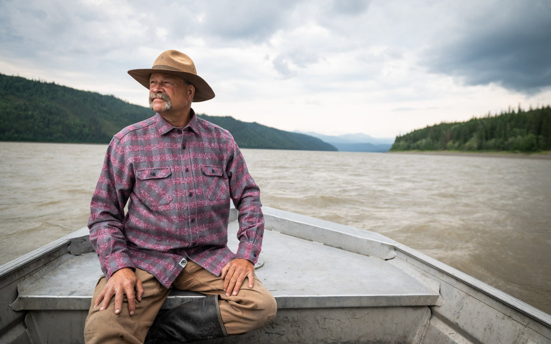 MuskOx Flannels, Man in Canoe wearing Burgundy Grand Flannel