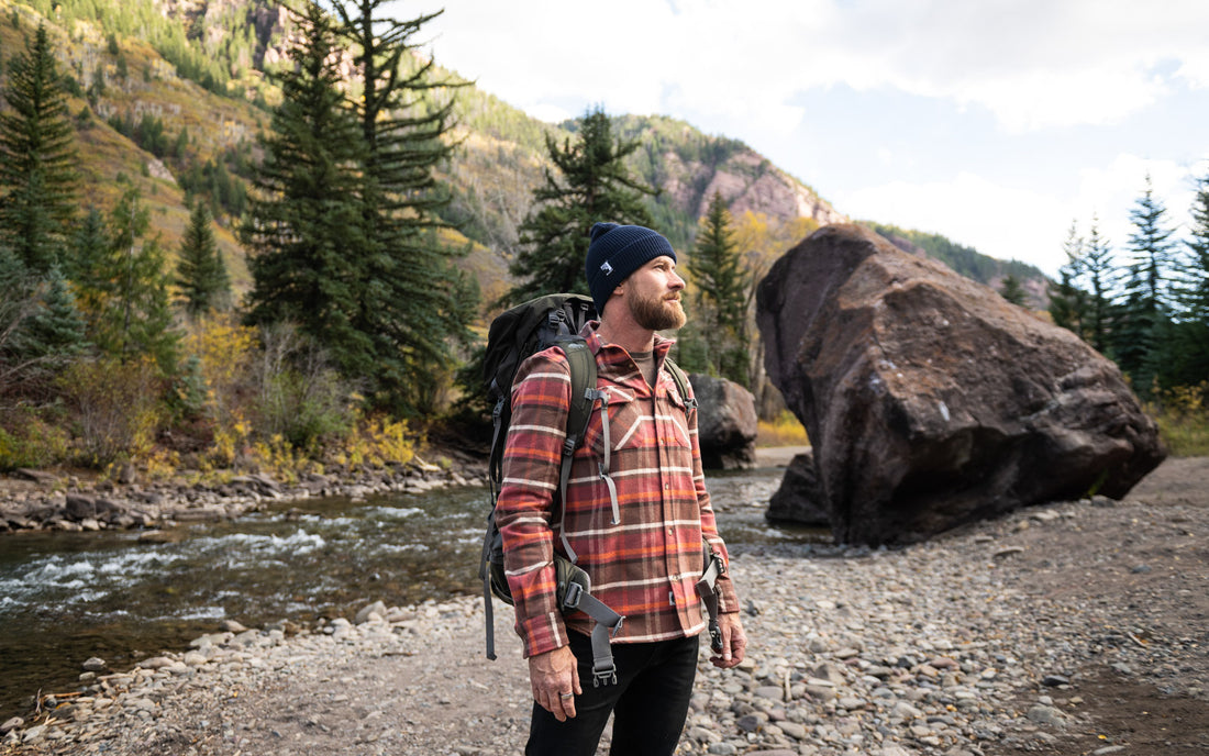 Man getting ready for backpacking wearing a MuskOx Flannel