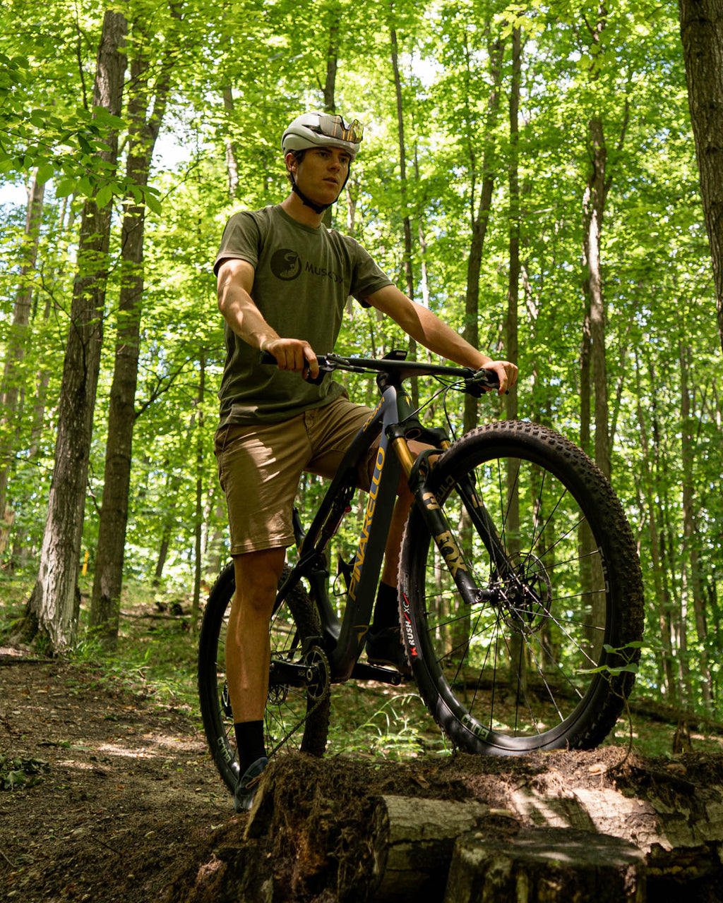 MuskOx Military Green Logo Tee on Mountain Biker, Kyan Olshove